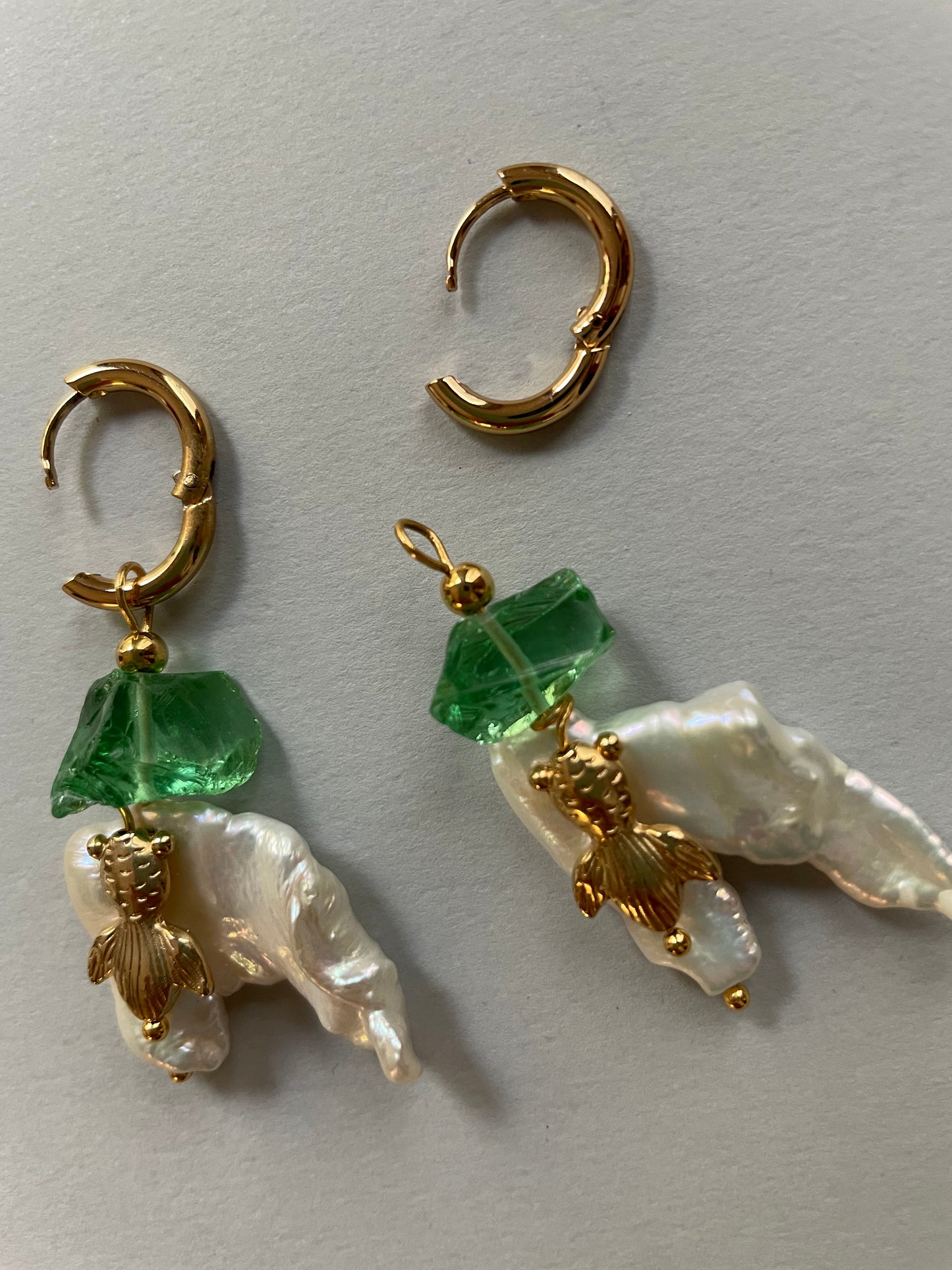 Fish hoop earrings in green